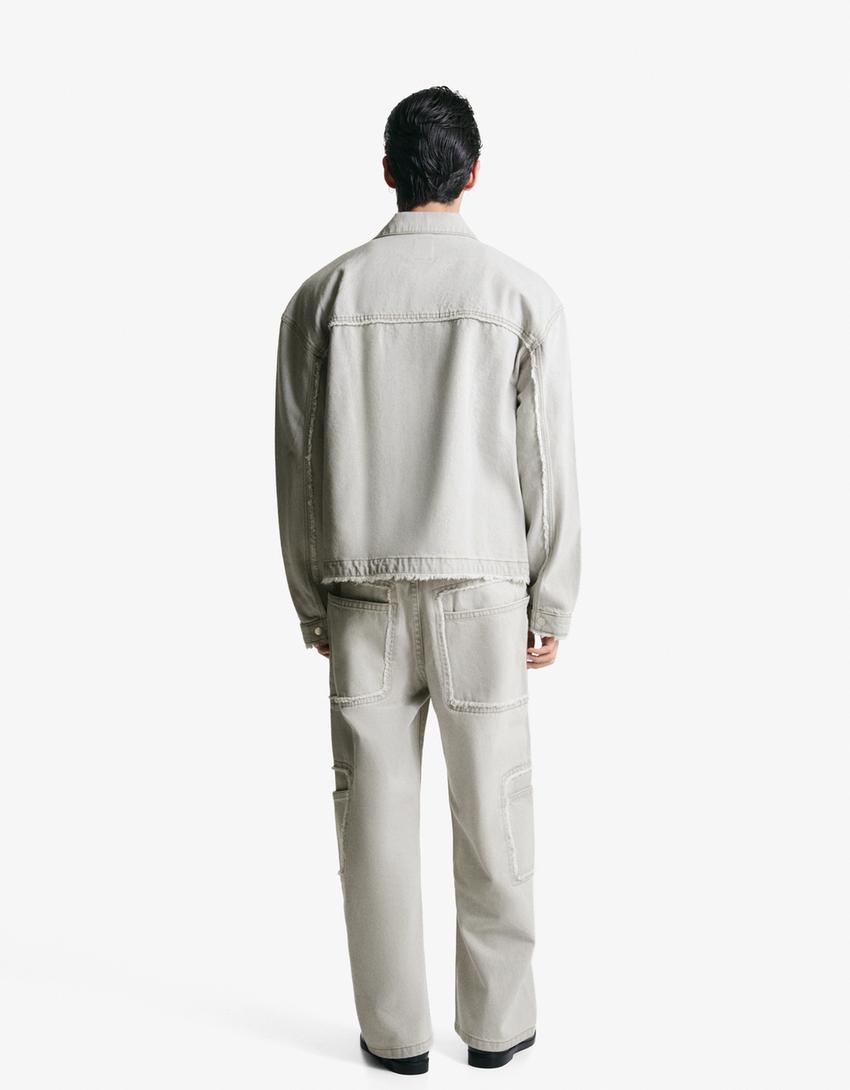 Giubbotto di jeans sfrangiato
